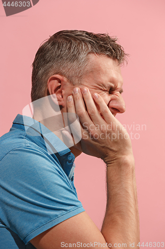 Image of Young man is having toothache.