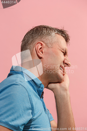 Image of Young man is having toothache.