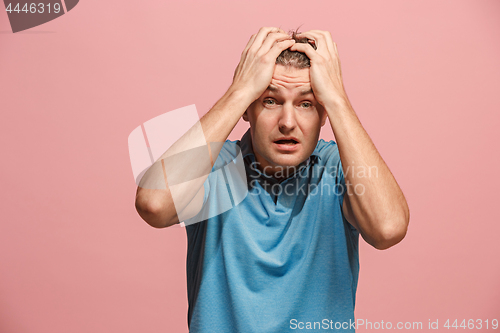 Image of Handsome man in stress isolated on pink