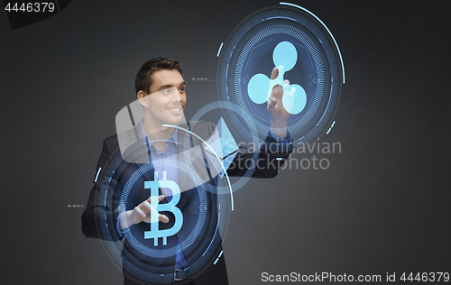 Image of businessman with cryptocurrency holograms