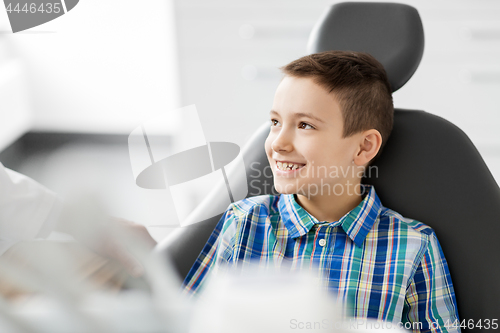 Image of happy smiling kid patient at dental clinic