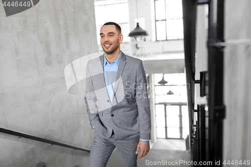 Image of businessman walking upstairs
