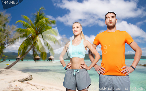 Image of happy couple exercising at summer