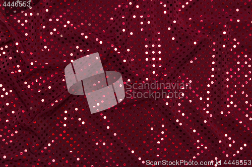 Image of Dark red fabric with sparkling metallic dots design