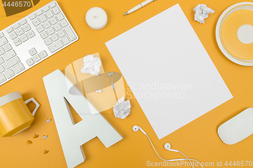 Image of Vibrant white and yellow home office workspace