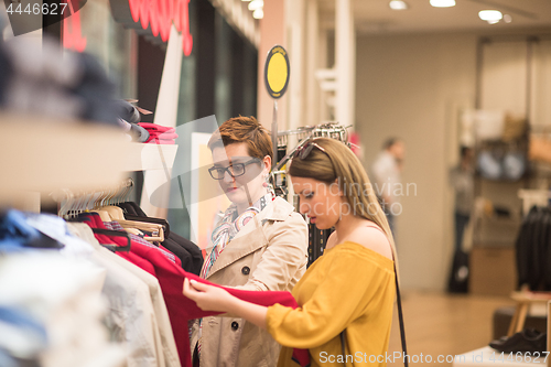 Image of best friend shopping in big mall