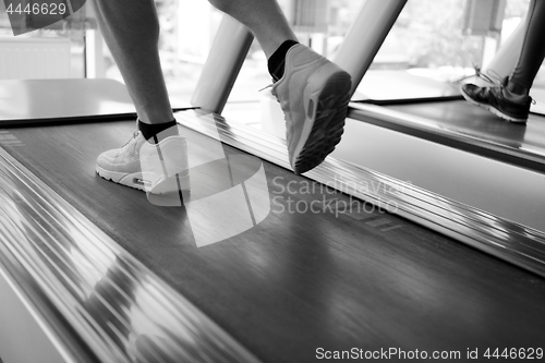 Image of sportsman exercise jogging on treadmill