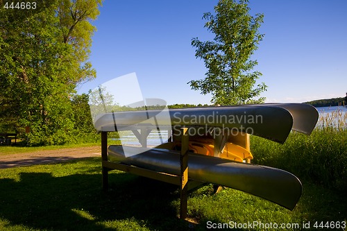 Image of Canoes Resting by Lake