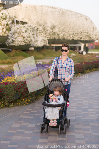 Image of mother and daughter in flower garden