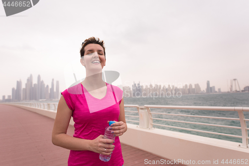 Image of young woman celebrating a successful training run