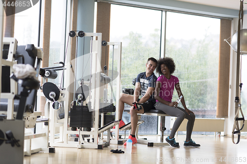 Image of couple in a gym have break