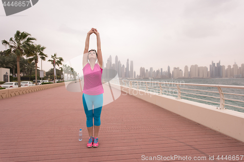 Image of woman stretching and warming up