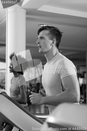 Image of sportsman exercise jogging on treadmill