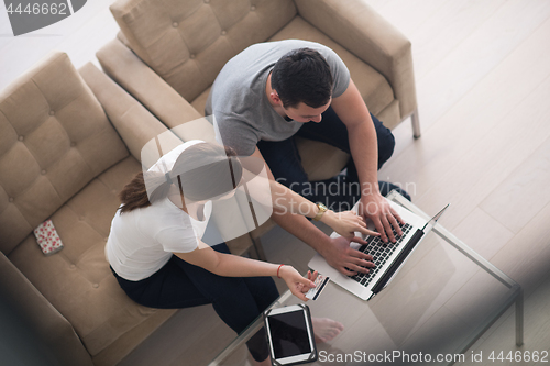 Image of happy young couple buying online