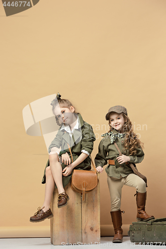 Image of Two beautiful girls on a pastel background