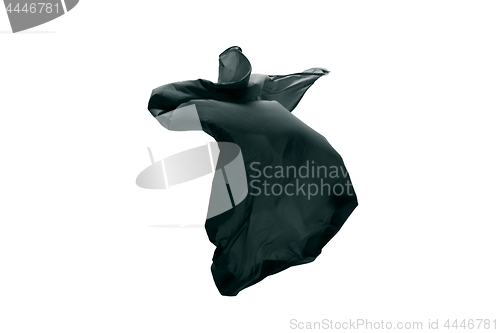 Image of Smooth elegant transparent black cloth separated on gray background.