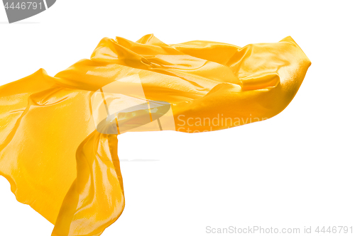 Image of Smooth elegant transparent yellow cloth separated on white background.