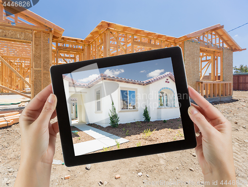 Image of Female Hands Holding Computer Tablet with Finished House on Scre