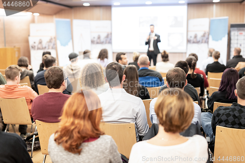 Image of Business speaker giving a talk at business conference event.