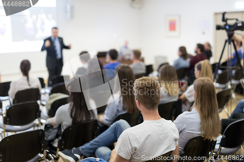 Image of Professor lecturing in lecture hall at university.