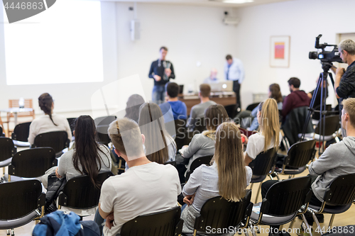 Image of Professor lecturing in lecture hall at university.