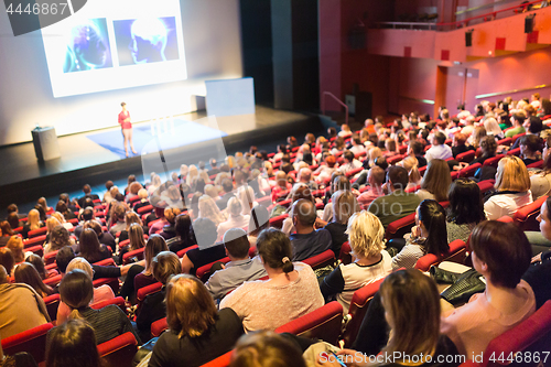 Image of Speaker giving presentation on scientific business conference.