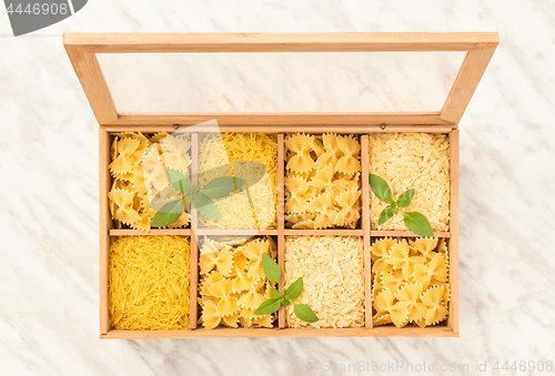 Image of Wooden storage box with different types of pasta