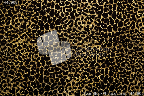 Image of Black fabric with golden leopard fur print