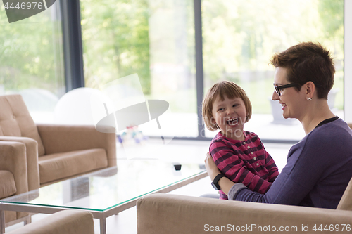 Image of mother and cute little girl enjoying their free time