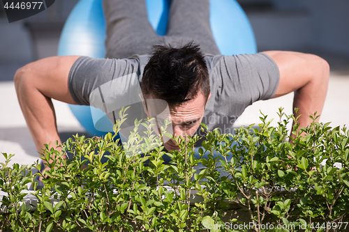 Image of man doing morning yoga exercises