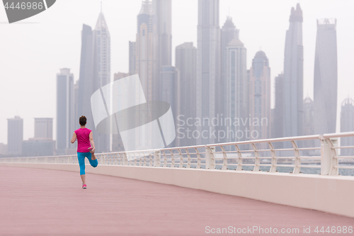 Image of woman stretching and warming up