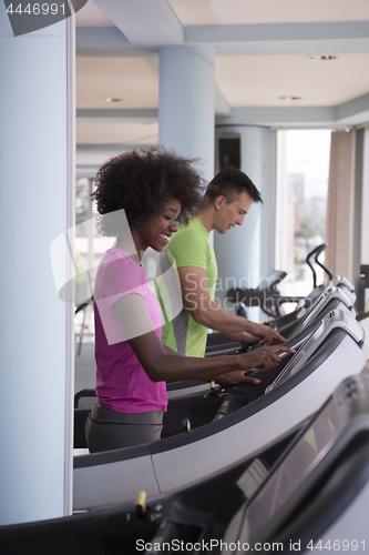 Image of people exercisinng a cardio on treadmill in gym