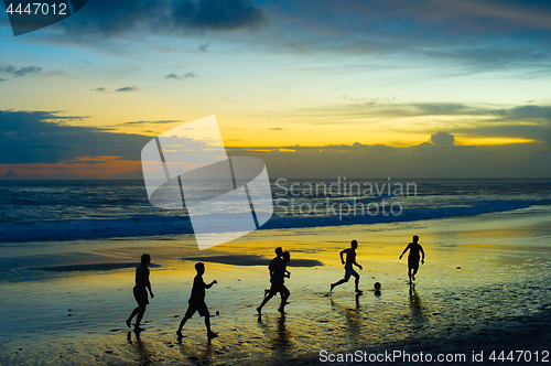 Image of Football on the beach. silhouette