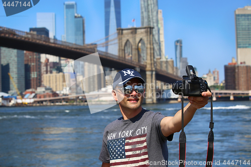 Image of New York, USA – August 23, 2018: Tourist taking a selfie from 