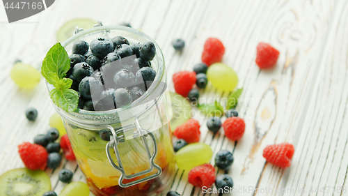 Image of Jar filled with fresh berries