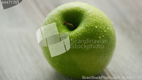 Image of Green ripe apple with water drops 