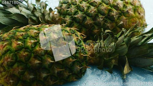 Image of Halves of unpeeled pineapples