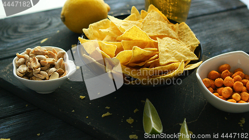 Image of Served snacks on board on table