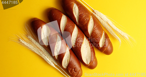 Image of Golden baguettes with wheat ears