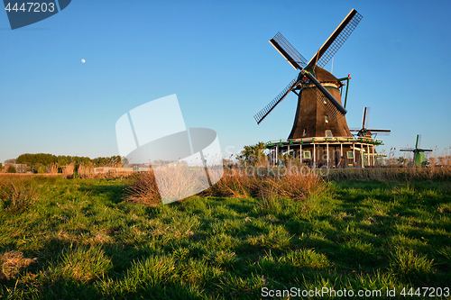 Image of Windmills at Zaanse Schans in Holland on sunset. Zaandam, Nether