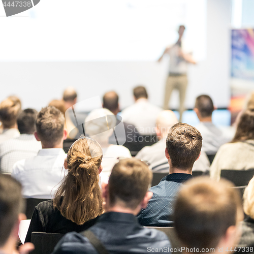 Image of Business speaker giving a talk at business conference event.