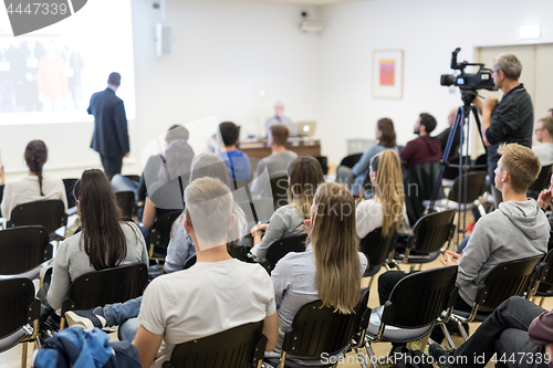 Image of Professor lecturing in lecture hall at university.