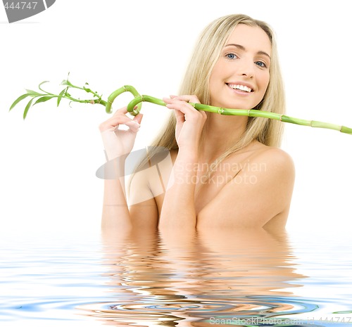 Image of happy blonde with bamboo