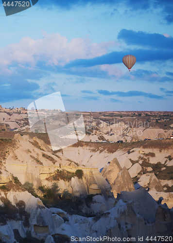 Image of Hot air balloon flying over the rocks of Cappadocia