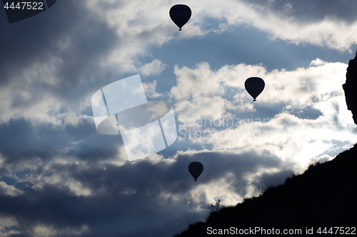 Image of Silhouettes of the hot air balloons flying