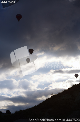 Image of Silhouettes of the hot air balloons flying