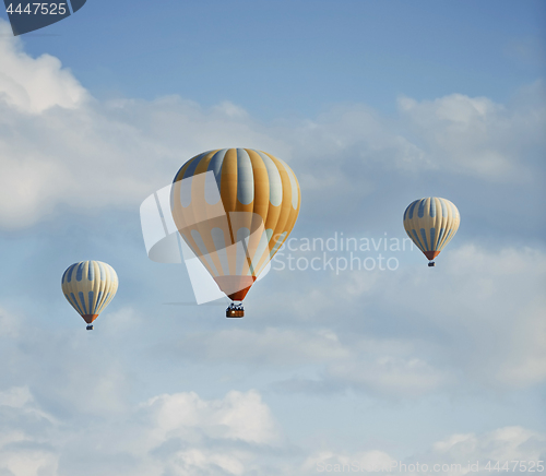 Image of Three air balloons flying in the sky