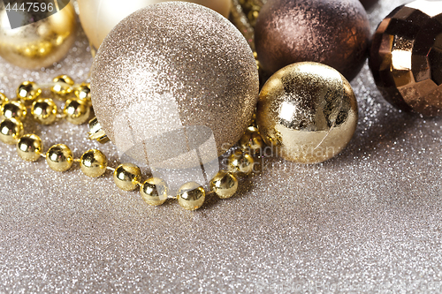 Image of Christmas golden and brown decorations.