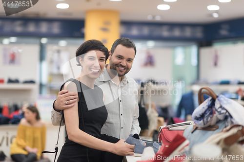 Image of couple chooses shoes At Shoe Store