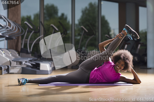 Image of african american woman exercise yoga in gym